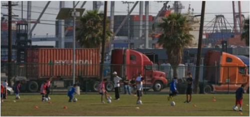 trucks next to a soccer field