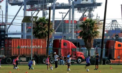 trucks next to a soccer field