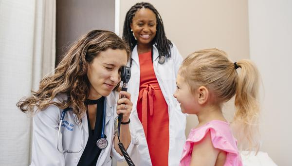 Medical Student working with patient